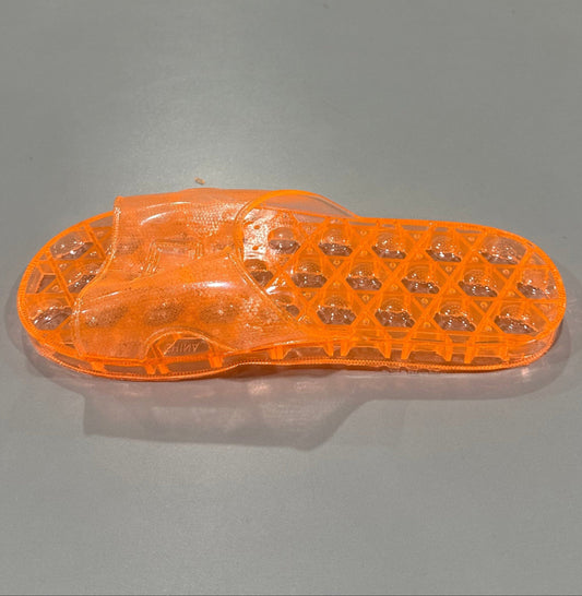 right pair of shower sandal in translucent orange
