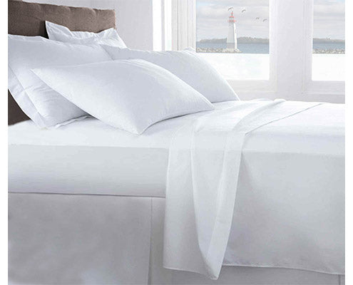 flat sheet on the top of mattress with luxury pillows