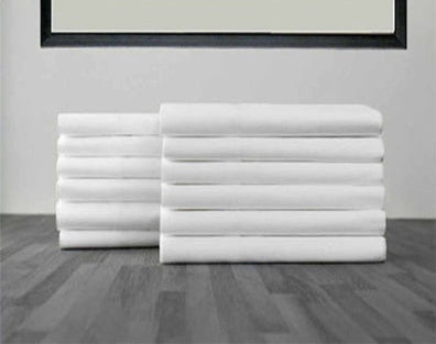 pile of white pillowcases 